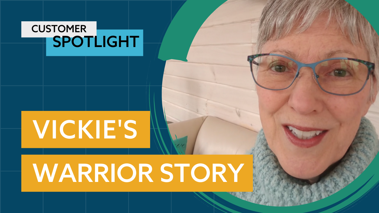 An older woman with short gray hair and glasses smiles at the camera. Text reads "Customer Spotlight" at the top and "Vickie's Warrior Story" on a yellow banner below. The background includes geometric shapes in teal and dark blue.