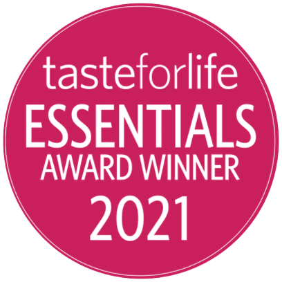 A circular pink badge with white text that reads, "tasteforlife ESSENTIALS AWARD WINNER 2021.
